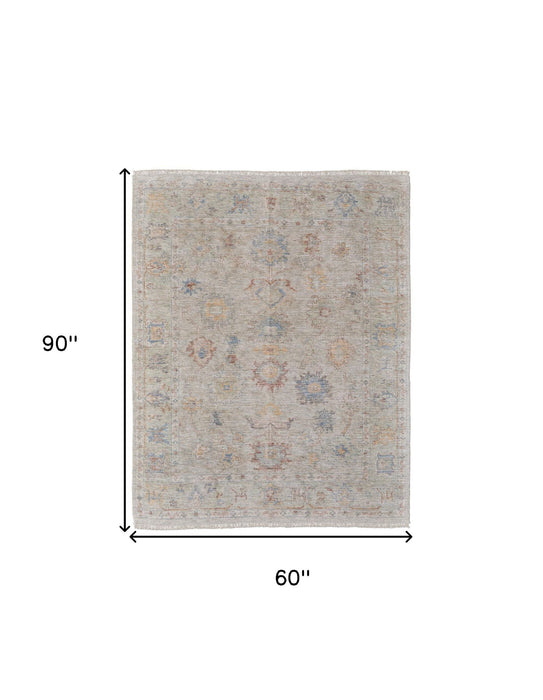 5' X 8' Floral Hand Woven Distressed Area Rug With Fringe - Tan