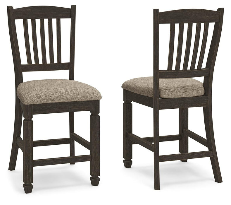Set of two Tyler Creek upholstered barstools by Signature Design in black and grayish brown fabric with wooden legs.