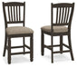 Set of two Tyler Creek upholstered barstools by Signature Design in black and grayish brown fabric with wooden legs.