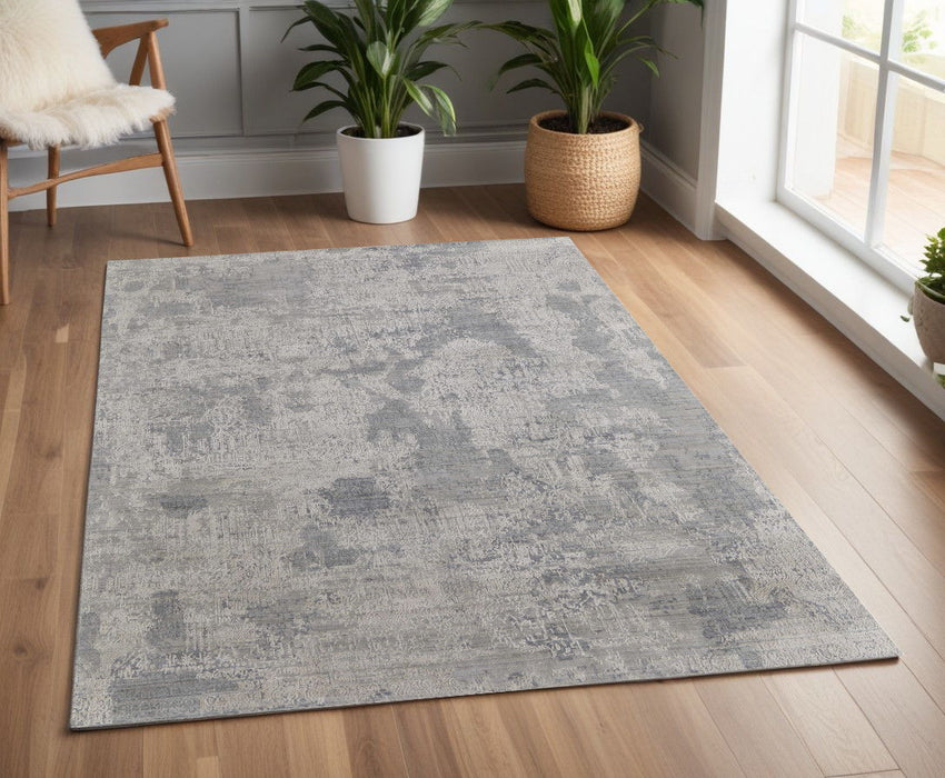 4' x 6' Casual Abstract Hand Woven Worn Faded Area Rug - Gray And Silver