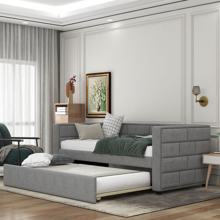 Gray upholstered Giga twin size daybed with trundle, padded back and sides, featuring a sleek, modern design for versatile bedroom use.