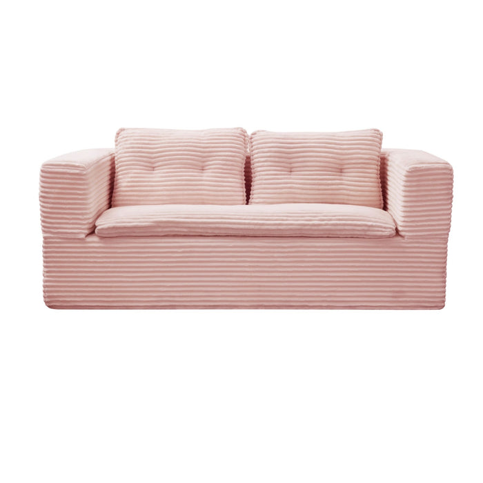 Baby pink Giga futon sectional sofa bed with independent chaise lounge, deep seat, and convertible king size bed option.