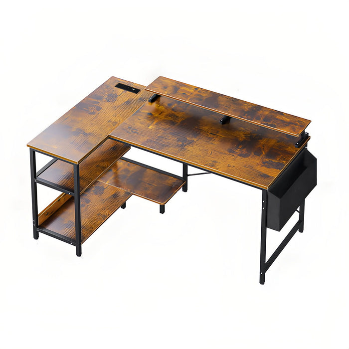Giga black and brown L-shaped gaming desk with power outlets, monitor stand, and storage shelves in a corner workstation setup.