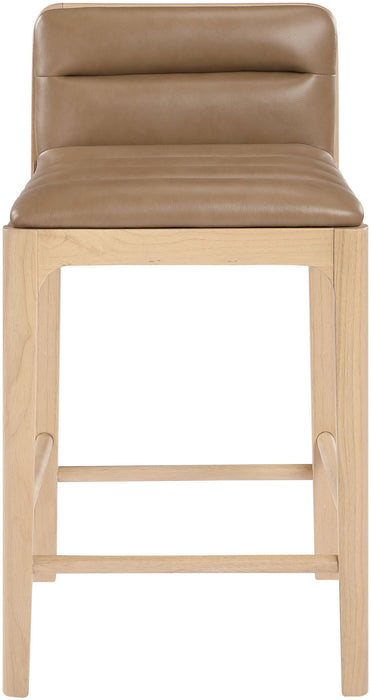 Set of two Meridian Furniture Ellis vegan leather upholstered counter stools in tan with natural wood legs.