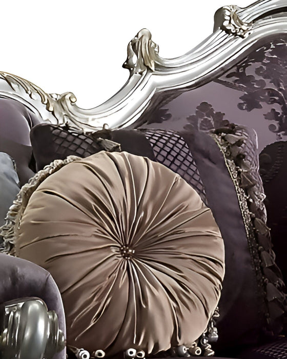 Dark purple velvet curved sofa with striped design, platinum legs, and matching toss pillows from HomeRoots stationary sofa collection.