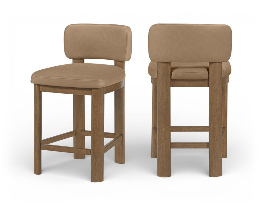 Set of two Meridian Furniture Paloma faux leather upholstered counter stools with brown frames, showcasing modern seating for kitchen or bar.