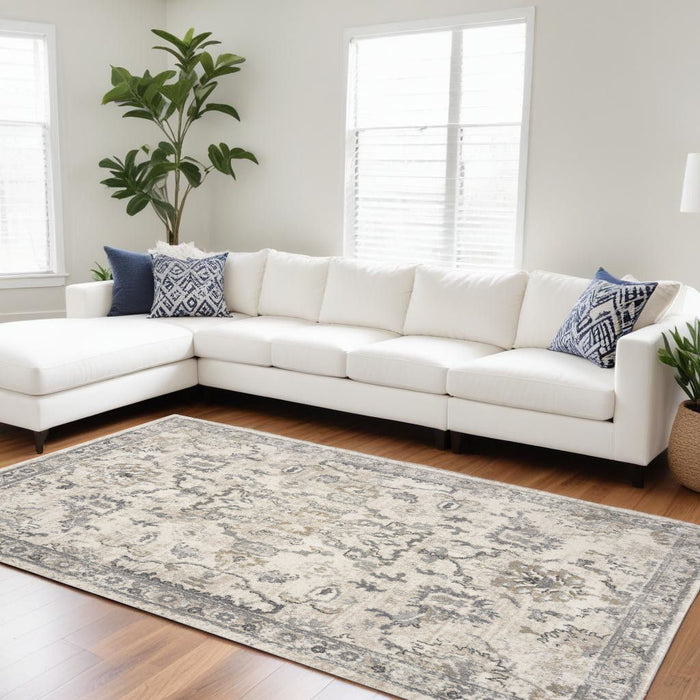 9' x 13' Machine Woven Distressed Floral Traditional Indoor Area Rug - Ivory