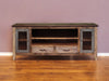 Distressed brown wood TV stand with enclosed storage and cabinet doors, perfect for modern living room organization.