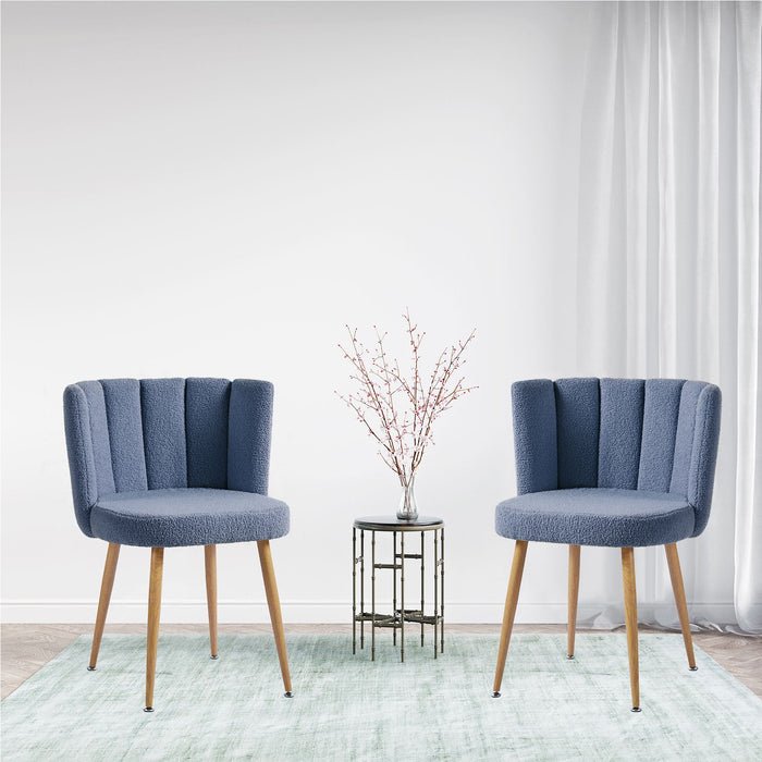 Set of two Giga modern dining chairs with wood-colored iron tube legs, cushioned seats, and comfortable backrests.