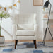 Giga modern upholstered accent armchair with soft padding, wooden legs, and pillow, ideal for living rooms or bedrooms.