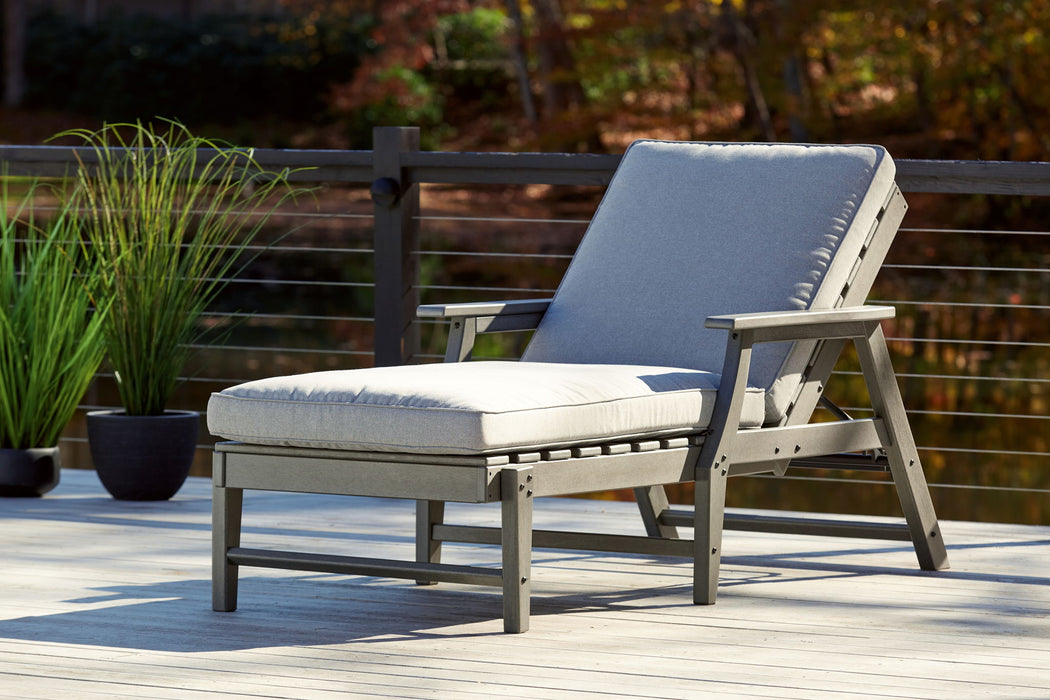 Gray Ashley Furniture Visola chaise lounge with cushion, showcasing a modern design and comfortable seating.
