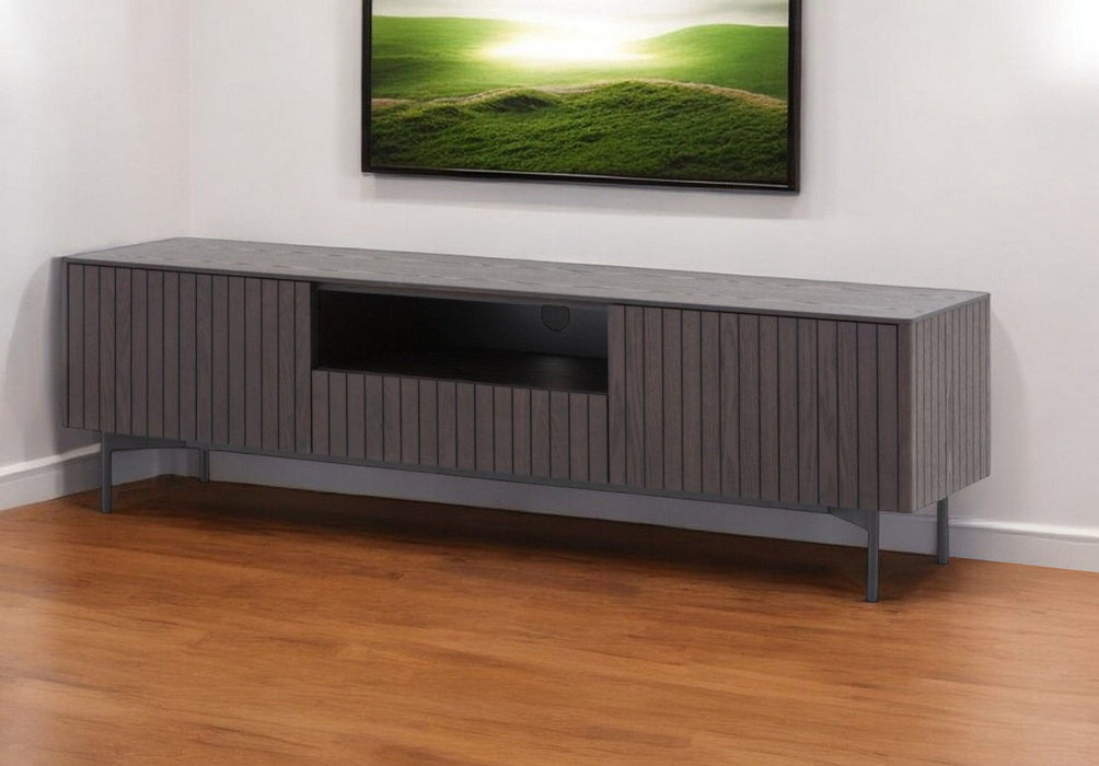 HomeRoots 63-inch wood and metal TV stand in black and dark brown with open and enclosed storage compartments.