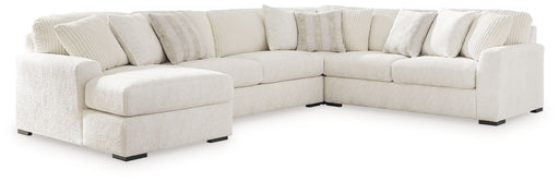 Signature Design by Ashley Chessington 4-piece sectional sofa with plush cushions and modern design in a spacious living room setting
