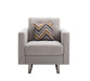 Giga Victoria fabric armchair with metal legs, side pockets, and a matching pillow, showcasing a cozy, stylish seating option.