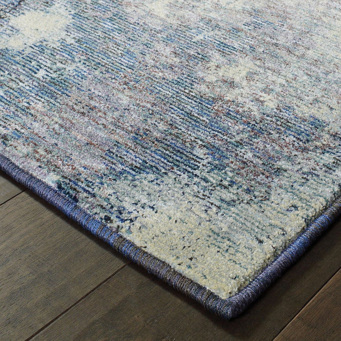 6.6' x 9.8' Abstract Power Loom Area Rug - Blue And Ivory