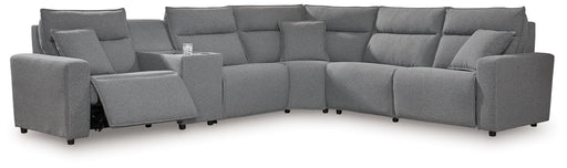 Signature Design by Ashley Modmax II 6-piece reclining sectional sofa with plush cushions and modern upholstery in a stylish living room setting.