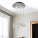 HomeRoots four-light metal and glass chandelier with nickel finish and clear glass shades, designed for ceiling lighting.