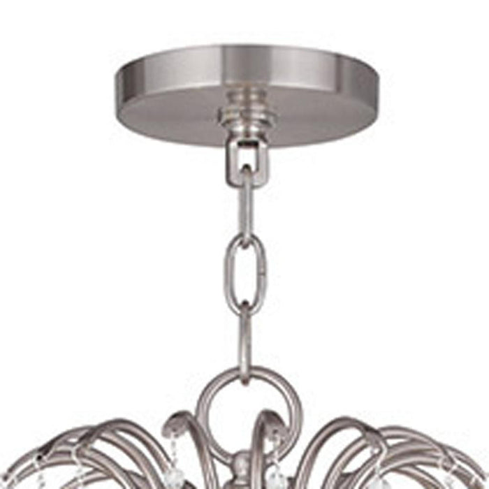 HomeRoots 33-inch metal chandelier with eight clear shades, dimmable lighting, featuring a nickel finish and modern design.