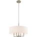 HomeRoots 23-inch metal chandelier with four shades, dimmable, in nickel finish with cream-colored shades, perfect for elegant lighting.