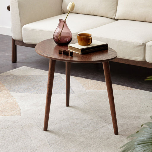 Giga walnut low coffee table with pebble-shaped solid oak wood top and natural finish, perfect for modern living rooms.