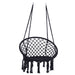 Giga macrame hanging hammock chair with rope swing design, suitable for indoor and outdoor use, featuring woven seat and sturdy support ropes.