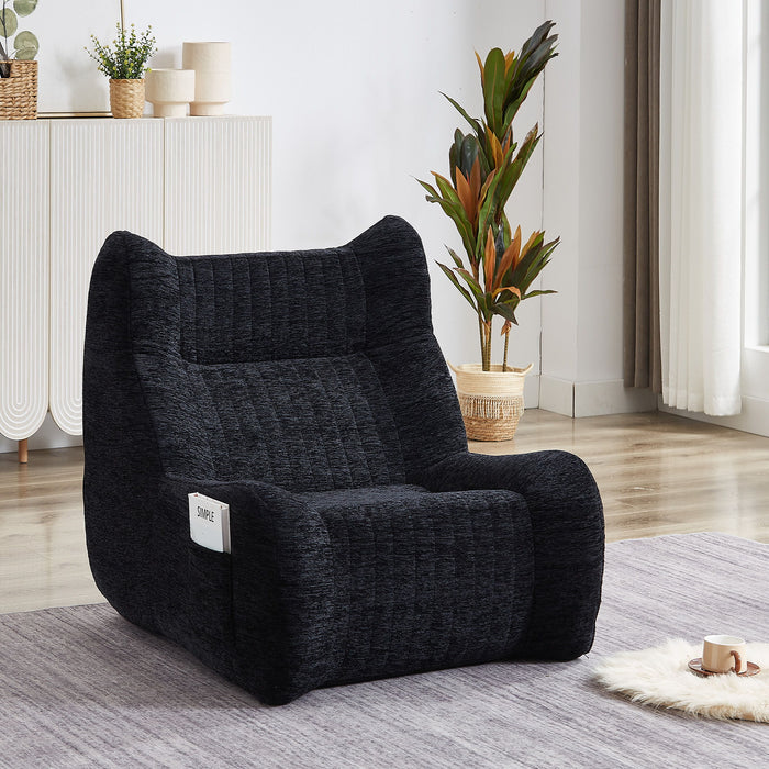 Giga black oversized bean bag chair with armrests, plush lounge floor sofa for living room relaxation and comfort.