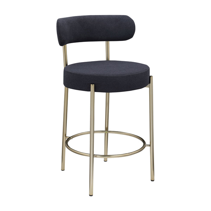 Set of 2 Giga modern Sherpa counter height barstools with brushed brass legs, upholstered seats, footrests, and low round backs.