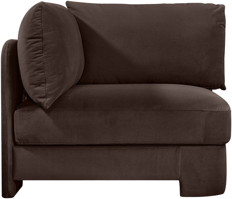 Velvet upholstered corner chair by Meridian Furniture, stationary accent chair with plush fabric and modern design.