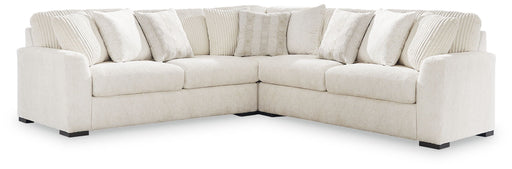Signature Design by Ashley Chessington 3-piece sectional sofa with plush cushions and neutral fabric, perfect for modern living rooms.