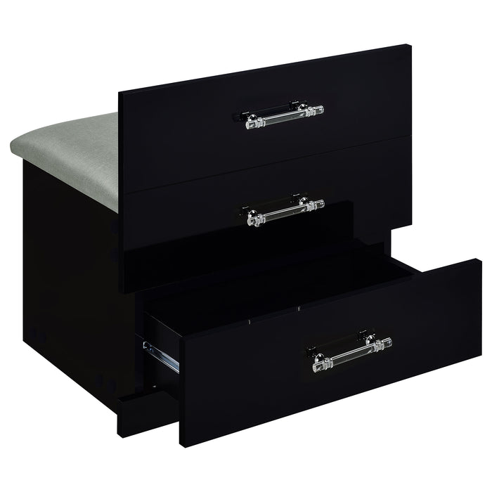 Black high gloss Danbury makeup vanity with three drawers and matching stool, featuring sleek modern furniture design.