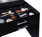 Black high gloss Danbury 3-drawer makeup vanity with attached mirror and matching stool, featuring sleek furniture design.