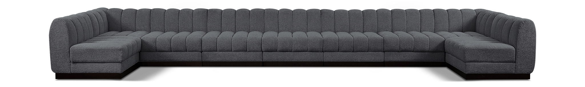 Quinn Meridian Furniture 9-piece modular sectional sofa with beige fabric upholstery and plush cushions in a modern living room setting.