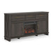 Signature Design by Ashley Brazen Valley TV stand with fireplace insert, wood finish, and modern storage compartments.