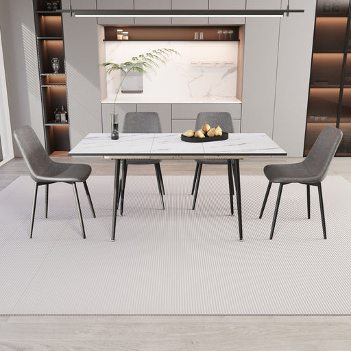 Modern Giga extendable dining table with five matching chairs in a stylish dining room setup.