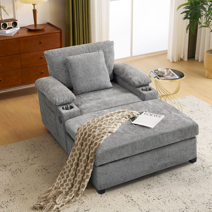 Giga modern oversized stationary chair with matching ottoman, cupholders, and built-in USB charging ports in a contemporary living space.