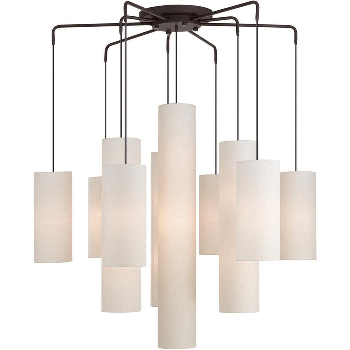 Nine-light metal chandelier with bronze finish and cream shades, dimmable HomeRoots chandelier for elegant lighting.