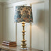 Signature Design by Ashley Poly Table Lamp in antique gold finish, with a sleek modern base and fabric lampshade.