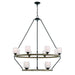 Black metal chandelier with twelve candle-style lights, dimmable with shades, by HomeRoots, featuring a modern chandelier design.