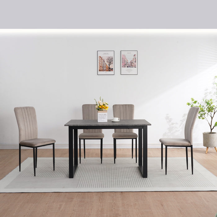Set of four Giga velvet dining chairs with plush upholstery and sleek wooden legs, perfect for modern dining room decor.
