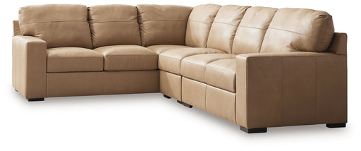 Signature Design by Ashley Bandon 3-piece stationary sectional sofa with plush cushions and modern design in a spacious living room setting.