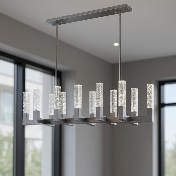 HomeRoots silver chandelier with twelve candle-style metal arms, clear shades, and dimmable lighting for elegant room decor.