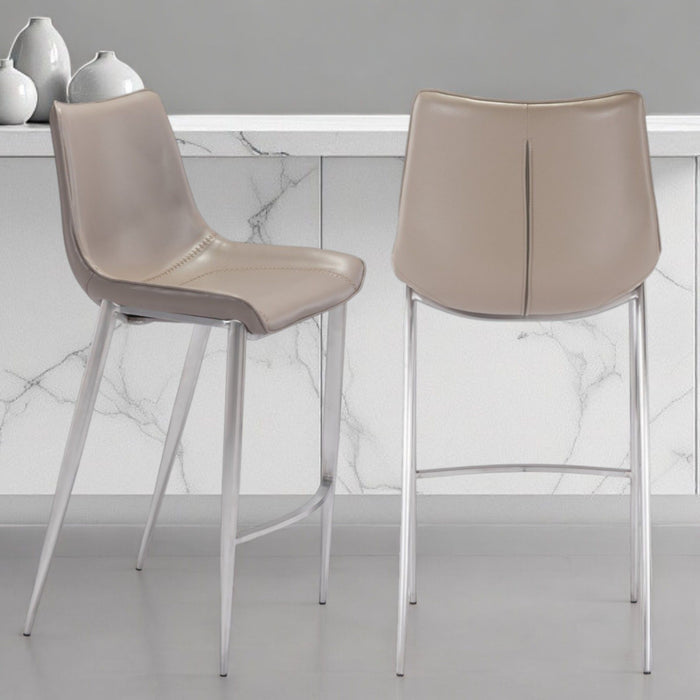 Set of two 30-inch gray and silver steel low back bar chairs from HomeRoots, featuring sleek modern design for bar or counter seating.