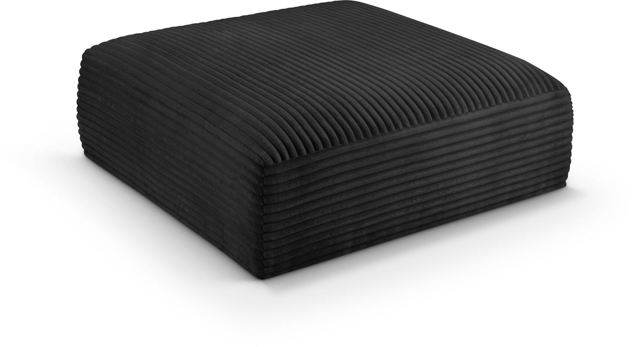 Meridian Furniture Shaggy upholstered ottoman with soft, plush shaggy fabric, serving as a stylish and comfortable accent piece.