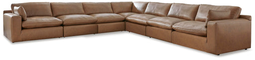 Emilia 7-piece stationary sectional sofa by Signature Design Ashley with plush cushions and modern design in a living room setting.