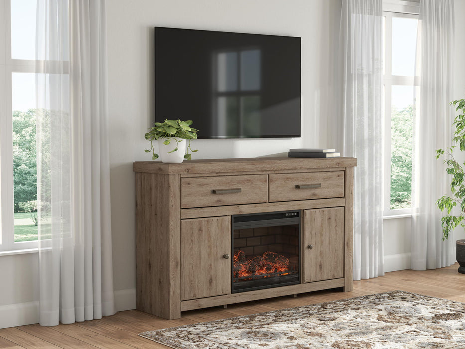 Signature Design by Ashley Garistyn TV stand with built-in fireplace, featuring wood finish and storage cabinets.