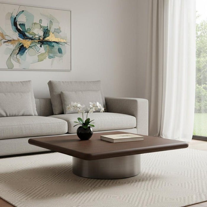 HomeRoots wood and stainless steel square pedestal coffee table in brown and silver with a modern design.