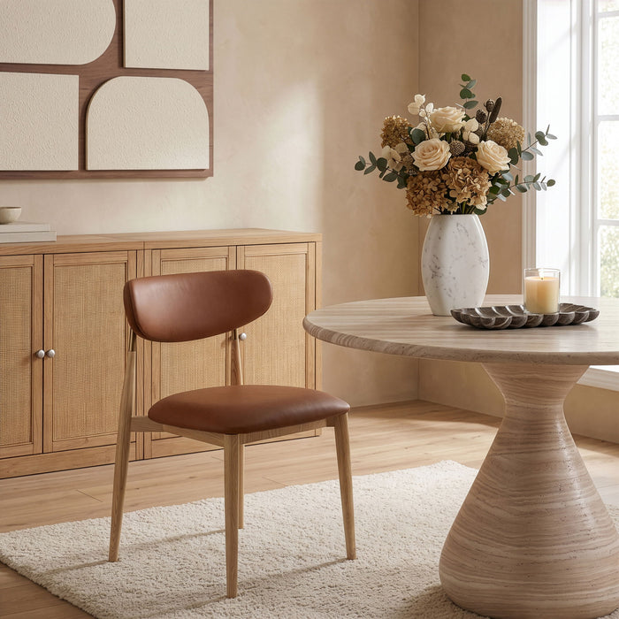 Vegan leather upholstered Meridian Furniture Ronda side chair with natural wood legs, modern dining room seating