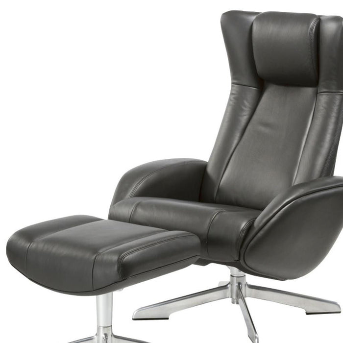 Black genuine leather tufted swivel recliner with matching ottoman by HomeRoots, featuring a manual reclining mechanism and plush upholstery.