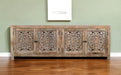 HomeRoots 86-inch carved floral distressed solid wood TV stand with enclosed storage and natural finish, featuring ornate carved details.
