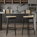 Set of two Giga swivel bar stools with metal frames and hand-woven paper rope seats, ideal for kitchen counters or dining areas.